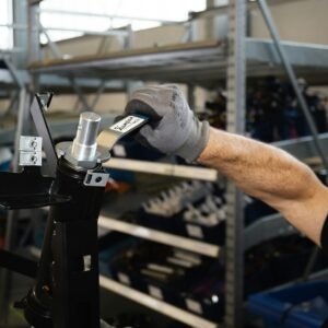 person holding black and silver steel tool